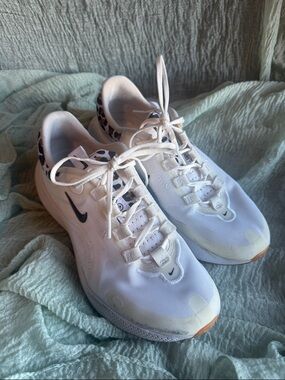 Nike White Sneakers with Black Swoosh and Leopard Accent